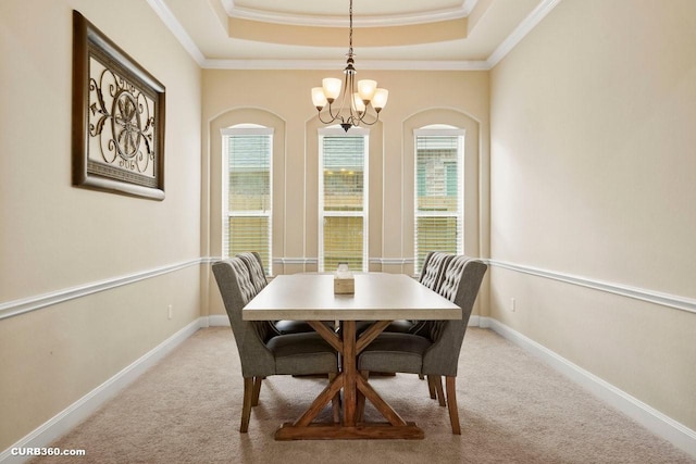 1522 Richland Hollow Ln, Friendswood, TX 77546 - dining room featuring a chandelier, a raised ceiling, carpet flooring, ornamental molding, and baseboards