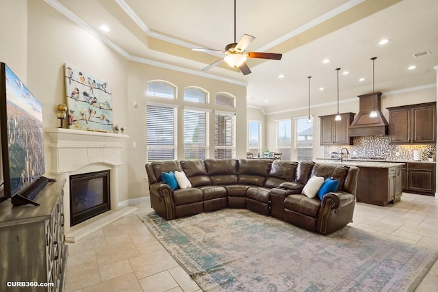 1522 Richland Hollow Ln, Friendswood, TX 77546 - living area with a ceiling fan, crown molding, a fireplace, recessed lighting, and baseboards