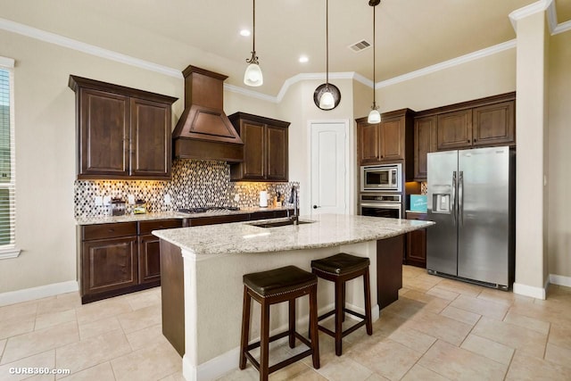 1522 Richland Hollow Ln, Friendswood, TX 77546 - kitchen featuring appliances with stainless steel finishes, a sink, premium range hood, decorative backsplash, and dark brown cabinetry