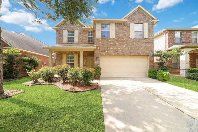 24526 Carlton Springs Ln, Katy, TX 77494 - traditional-style house featuring concrete driveway, a garage, brick siding, and a front yard