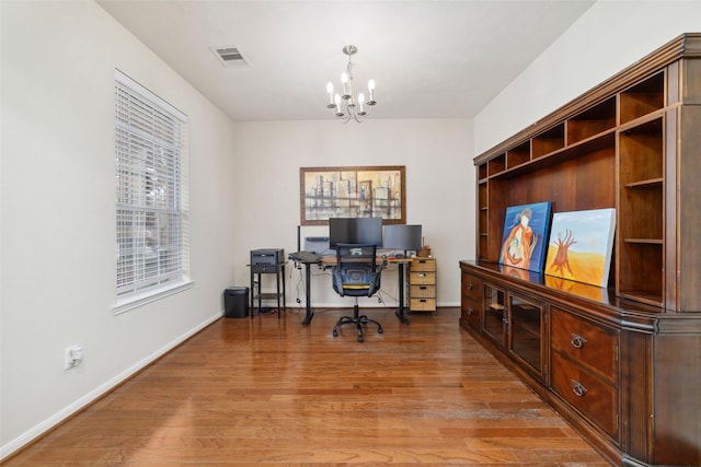 24526 Carlton Springs Ln, Katy, TX 77494 - office area featuring a chandelier, wood finished floors, and baseboards