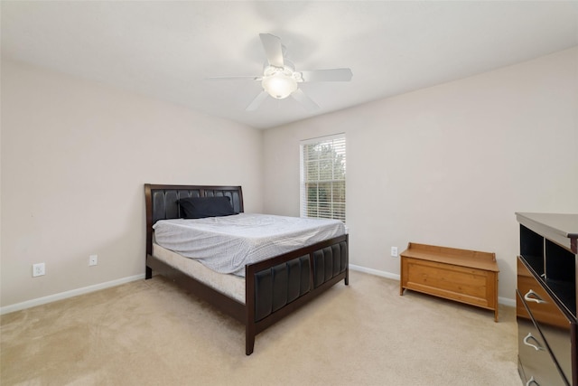 24526 Carlton Springs Ln, Katy, TX 77494 - bedroom with light carpet, baseboards, and a ceiling fan
