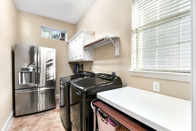 5702 Mustang Ridge Ln, Fulshear, TX 77441 - laundry area featuring cabinet space, separate washer and dryer, and baseboards