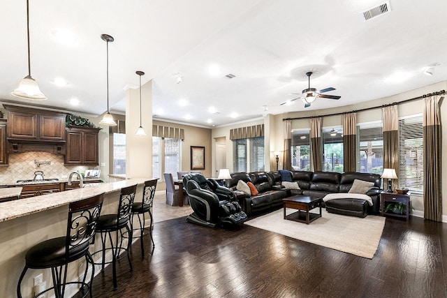 5702 Mustang Ridge Ln, Fulshear, TX 77441 - living room featuring ceiling fan, dark wood-style flooring, baseboards, ornamental molding, and recessed lighting