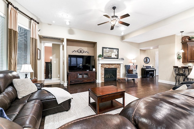 5702 Mustang Ridge Ln, Fulshear, TX 77441 - living area with baseboards, a ceiling fan, a fireplace, and dark wood-type flooring