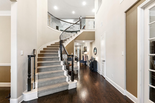 5702 Mustang Ridge Ln, Fulshear, TX 77441 - entrance foyer featuring stairway, wood finished floors, a towering ceiling, and baseboards