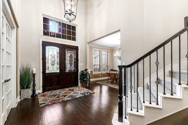 5702 Mustang Ridge Ln, Fulshear, TX 77441 - entrance foyer featuring a chandelier, a high ceiling, baseboards, stairs, and wood finished floors