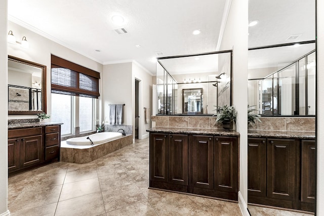 5702 Mustang Ridge Ln, Fulshear, TX 77441 - full bathroom with ornamental molding, a bath, two vanities, a shower stall, and recessed lighting