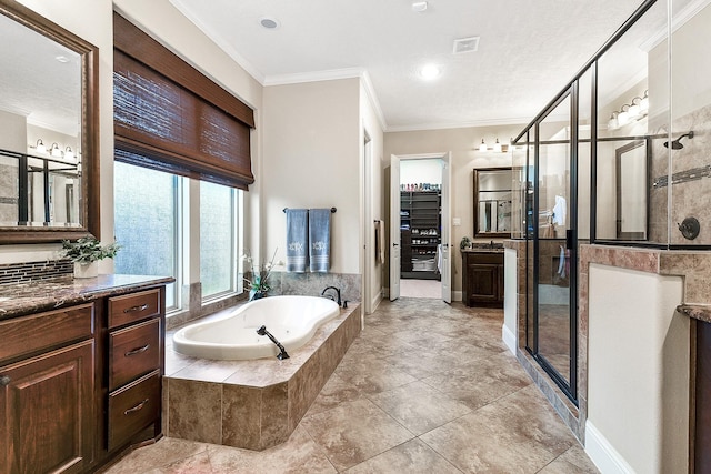 5702 Mustang Ridge Ln, Fulshear, TX 77441 - full bathroom featuring vanity, crown molding, a shower stall, a bath, and baseboards