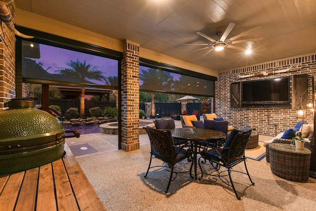 5702 Mustang Ridge Ln, Fulshear, TX 77441 - fenced backyard featuring a ceiling fan, a patio area, outdoor dining area, and area for grilling