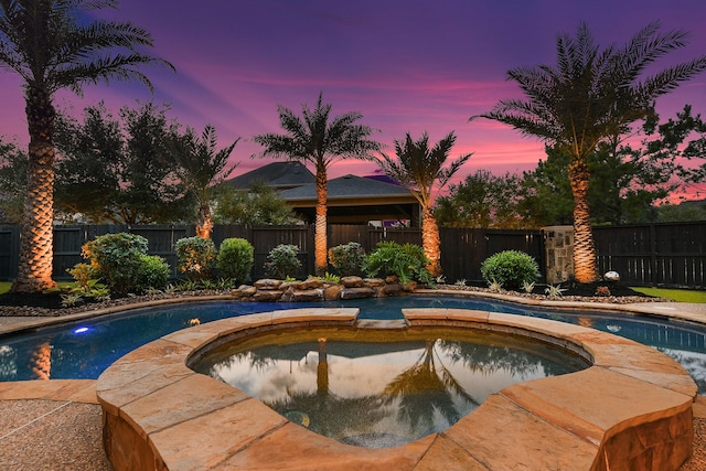5702 Mustang Ridge Ln, Fulshear, TX 77441 - view of swimming pool featuring a fenced backyard and a pool with connected hot tub
