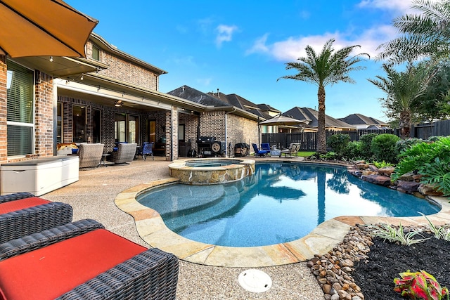 5702 Mustang Ridge Ln, Fulshear, TX 77441 - view of swimming pool featuring a patio, a fenced backyard, and a pool with connected hot tub
