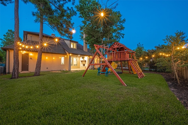105 Checkerbloom Ct, Montgomery, TX 77316 - rear view of property featuring a playground
