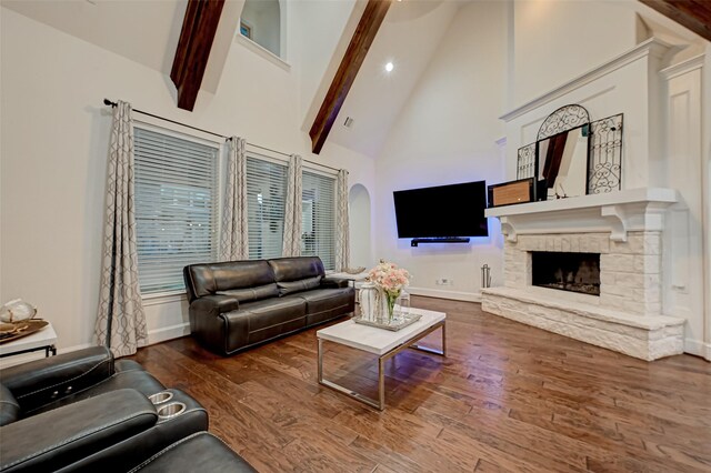 105 Checkerbloom Ct, Montgomery, TX 77316 - living room with high vaulted ceiling, baseboards, wood finished floors, beamed ceiling, and a fireplace