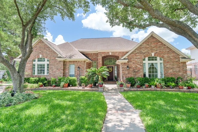 17503 Whispering Star Ct, Houston, TX 77095 - view of front of home with brick siding and a shingled roof