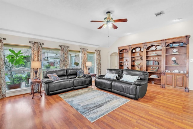 17503 Whispering Star Ct, Houston, TX 77095 - living room with lofted ceiling, a ceiling fan, light wood-style floors, and healthy amount of natural light