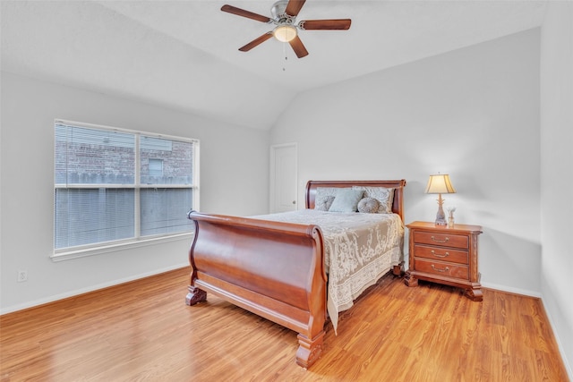 17503 Whispering Star Ct, Houston, TX 77095 - bedroom featuring vaulted ceiling, light wood-style floors, baseboards, and a ceiling fan
