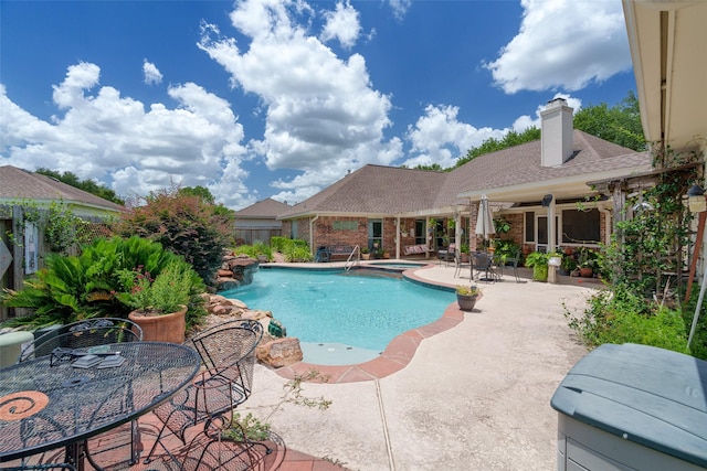 17503 Whispering Star Ct, Houston, TX 77095 - view of swimming pool with a patio area, a pool with connected hot tub, and outdoor dining space