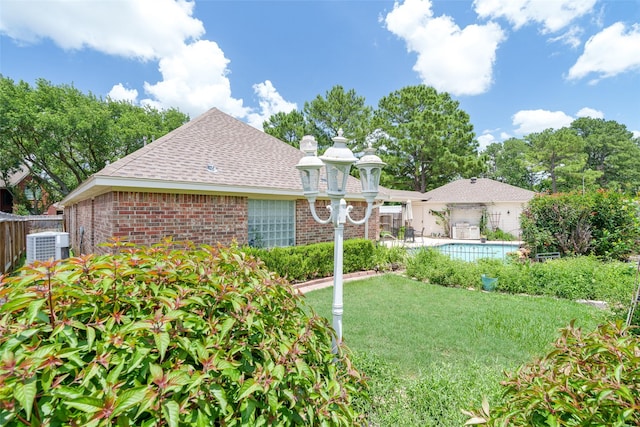 17503 Whispering Star Ct, Houston, TX 77095 - view of front facade with brick siding, roof with shingles, a community pool, and a chimney