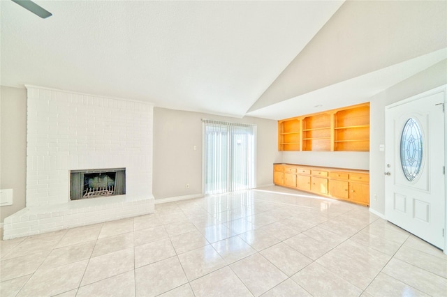11415 Pepperdine Ln, Houston, TX 77071 - unfurnished living room featuring light tile patterned flooring, lofted ceiling, a fireplace, baseboards, and built in shelves