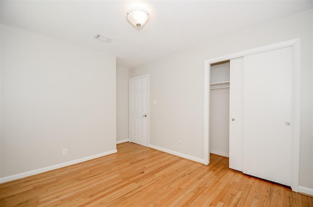 4410 Spellman Rd, Houston, TX 77035 - unfurnished bedroom with wood finished floors, baseboards, and a closet