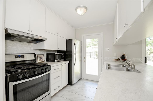 4410 Spellman Rd, Houston, TX 77035 - kitchen featuring appliances with stainless steel finishes, under cabinet range hood, a sink, light countertops, and white cabinets