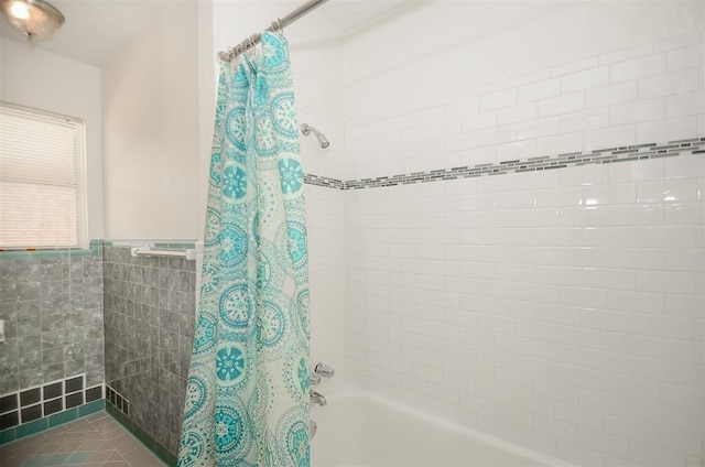 4410 Spellman Rd, Houston, TX 77035 - bathroom featuring shower / bath combination with curtain, wainscoting, and tile walls