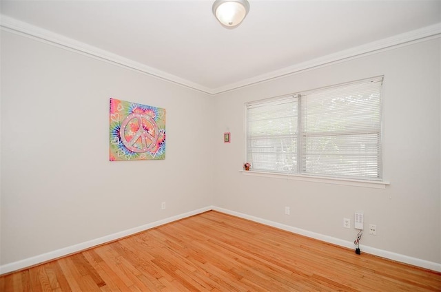 4410 Spellman Rd, Houston, TX 77035 - spare room with baseboards, light wood-style flooring, and crown molding