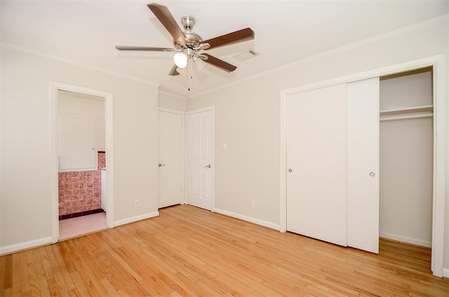 4410 Spellman Rd, Houston, TX 77035 - unfurnished bedroom with light wood-style flooring, baseboards, crown molding, ceiling fan, and a closet