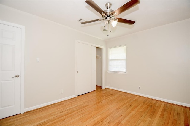 4410 Spellman Rd, Houston, TX 77035 - unfurnished bedroom featuring light wood finished floors, baseboards, a closet, crown molding, and a ceiling fan