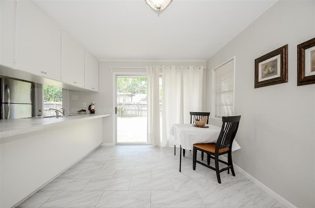 4410 Spellman Rd, Houston, TX 77035 - dining area featuring light marble finish flooring and baseboards