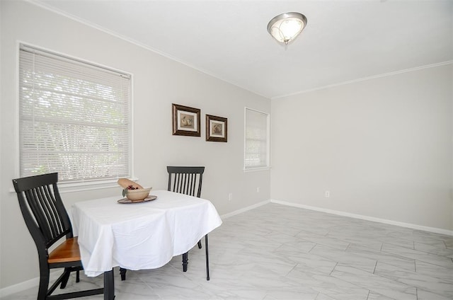 4410 Spellman Rd, Houston, TX 77035 - dining space with light marble finish flooring, crown molding, and baseboards