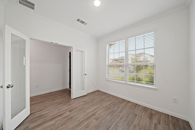 1312 Grass Bend Dr, Katy, TX 77493 - unfurnished bedroom featuring crown molding, wood finished floors, and baseboards
