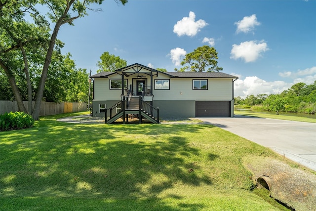 719 Fairfield St, Shoreacres, TX 77571 - view of front of property with an attached garage, concrete driveway, and stairway