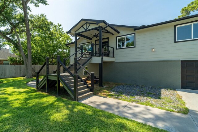 719 Fairfield St, Shoreacres, TX 77571 - view of front of house featuring a ceiling fan and stairway