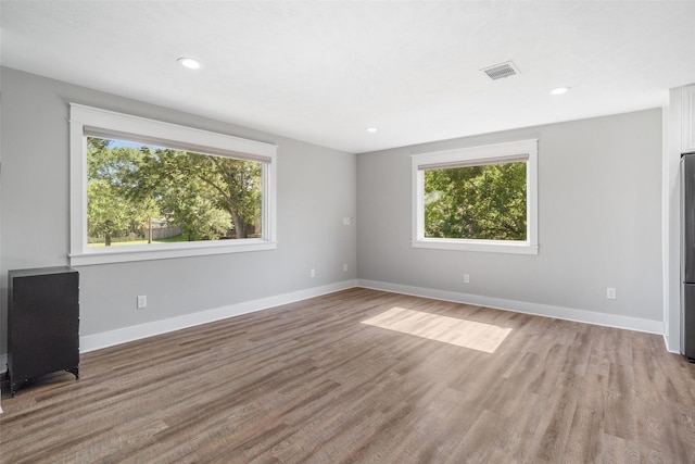 719 Fairfield St, Shoreacres, TX 77571 - spare room with light wood-style floors, baseboards, and recessed lighting