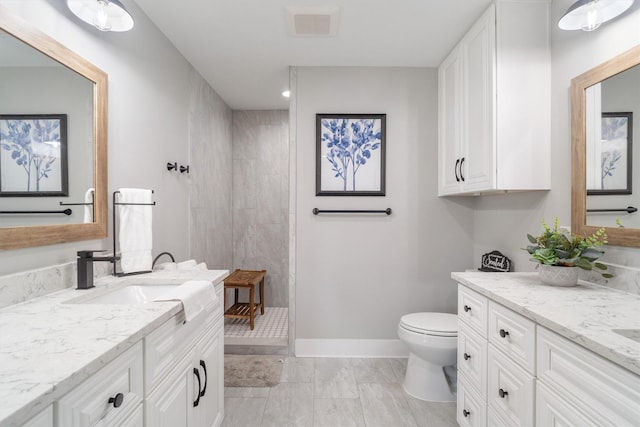 719 Fairfield St, Shoreacres, TX 77571 - full bath with two vanities, a walk in shower, and toilet