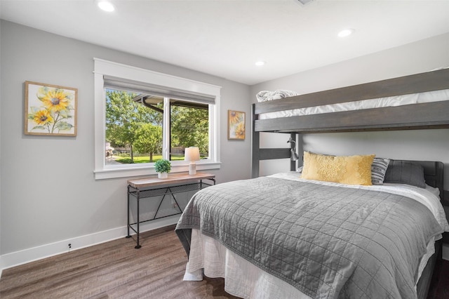 719 Fairfield St, Shoreacres, TX 77571 - bedroom featuring baseboards, wood finished floors, and recessed lighting