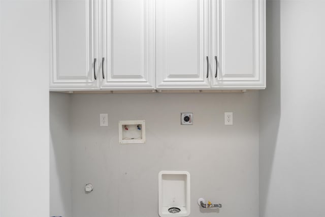 719 Fairfield St, Shoreacres, TX 77571 - laundry area with gas dryer hookup, hookup for a washing machine, electric dryer hookup, and cabinet space