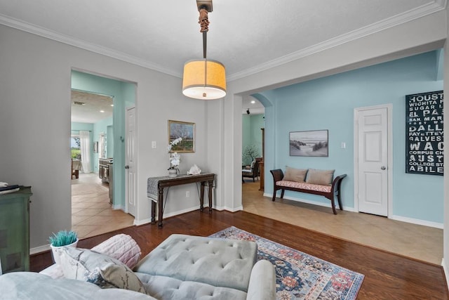 4510 Bonita Way, League City, TX 77573 - living area featuring crown molding, arched walkways, wood finished floors, and baseboards