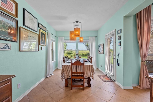 4510 Bonita Way, League City, TX 77573 - dining space featuring light tile patterned flooring and baseboards