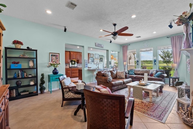 4510 Bonita Way, League City, TX 77573 - living area with a ceiling fan, a textured ceiling, light tile patterned floors, and recessed lighting