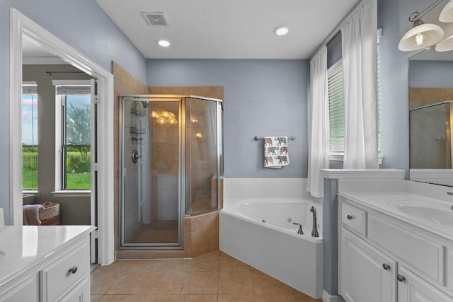 4510 Bonita Way, League City, TX 77573 - full bath with two vanities, a stall shower, a tub with jets, tile patterned floors, and recessed lighting
