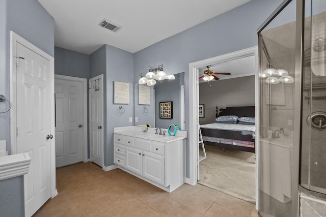 4510 Bonita Way, League City, TX 77573 - ensuite bathroom featuring vanity, a stall shower, a ceiling fan, tile patterned floors, and baseboards
