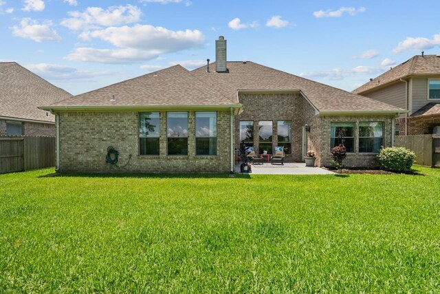 4510 Bonita Way, League City, TX 77573 - back of property featuring a patio area, brick siding, and roof with shingles