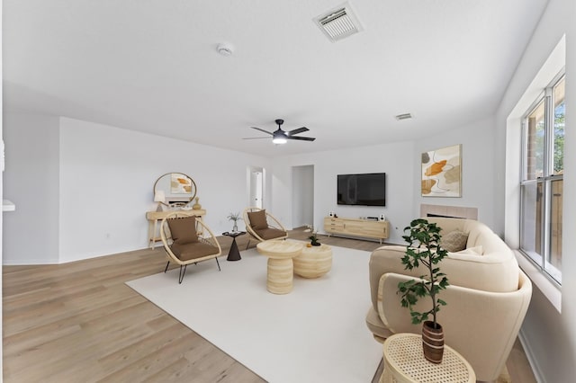 2411 Irish Spring Dr, Houston, TX 77067 - living area featuring light wood finished floors, ceiling fan, and baseboards