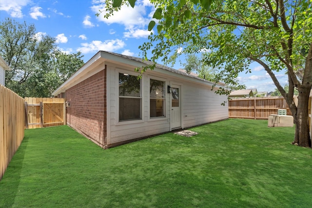 2411 Irish Spring Dr, Houston, TX 77067 - rear view of house with brick siding and a gate