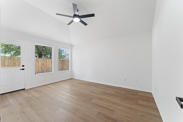 2411 Irish Spring Dr, Houston, TX 77067 - unfurnished room featuring vaulted ceiling, light wood finished floors, ceiling fan, and baseboards