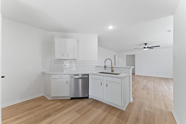 2411 Irish Spring Dr, Houston, TX 77067 - kitchen with a sink, dishwasher, a peninsula, light wood-style floors, and light countertops