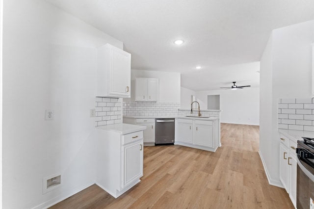 2411 Irish Spring Dr, Houston, TX 77067 - kitchen with stainless steel appliances, a peninsula, a sink, backsplash, and light countertops